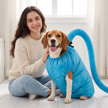 Woman sitting on the bathroom floor with her beagle wearing the blue hands-free dog drying bag